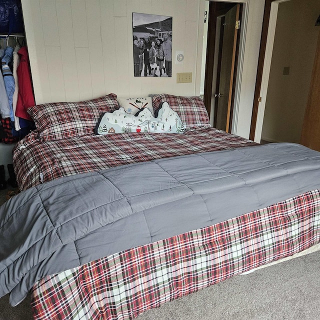 carpeted bedroom featuring a closet