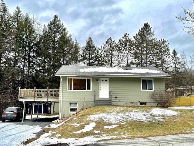 view of front of property with a wooden deck