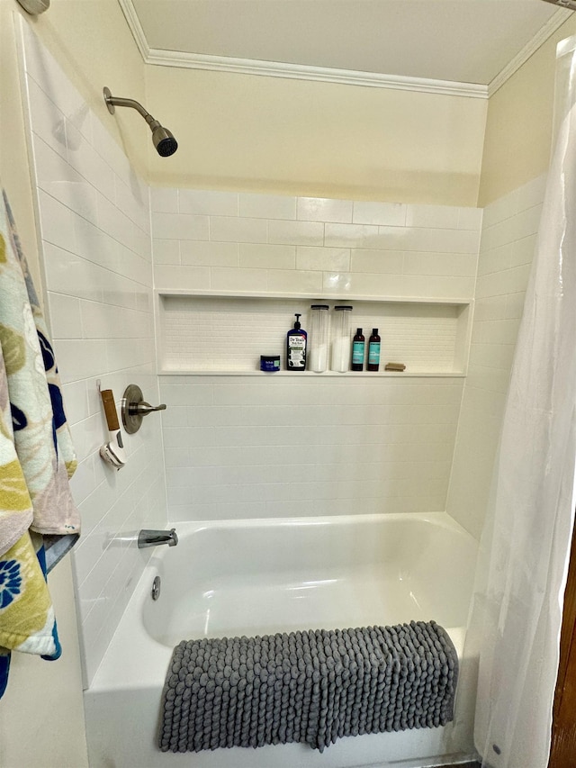 bathroom with shower / bath combination with curtain and ornamental molding