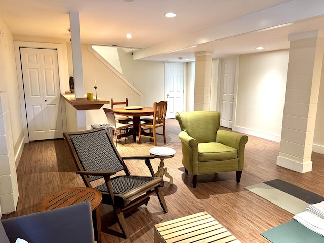 living area with hardwood / wood-style flooring