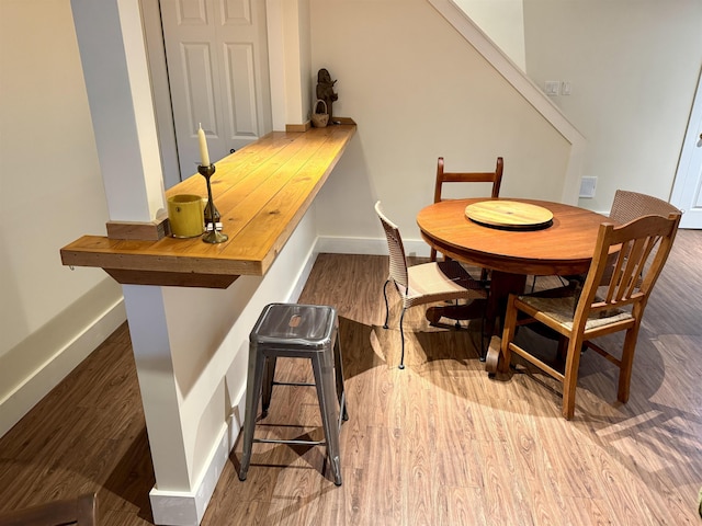 dining area featuring hardwood / wood-style flooring