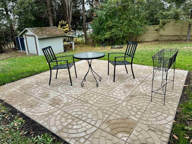 view of patio / terrace with a storage shed