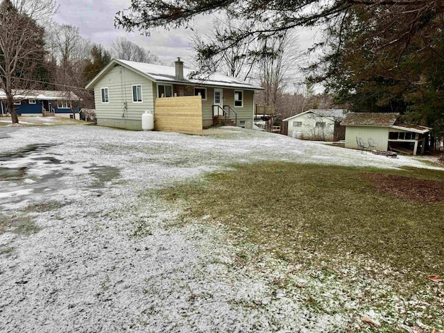 exterior space with a shed and a front lawn