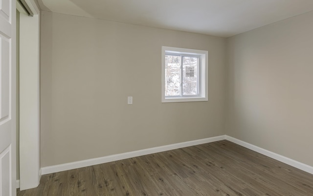 empty room featuring dark hardwood / wood-style floors