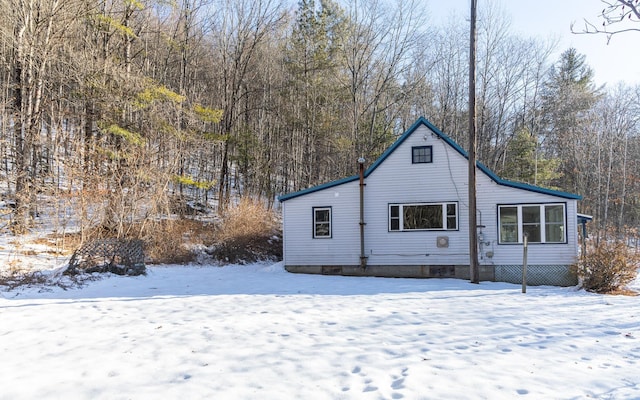 view of snow covered house