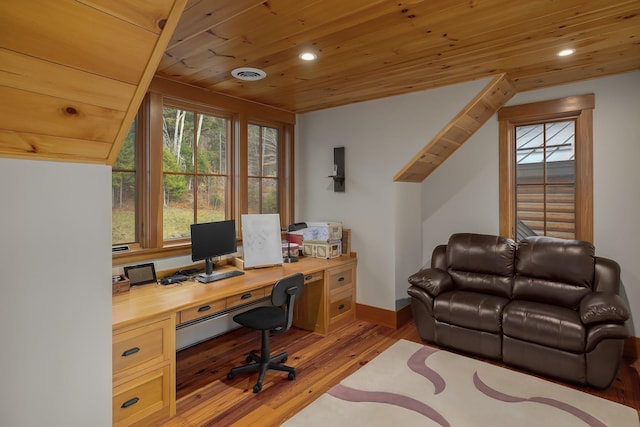 office featuring light wood-type flooring, built in desk, and wood ceiling