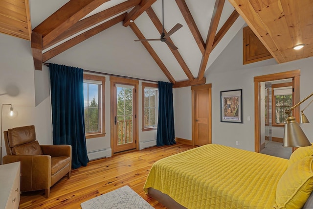 bedroom featuring light hardwood / wood-style floors, access to exterior, high vaulted ceiling, and multiple windows