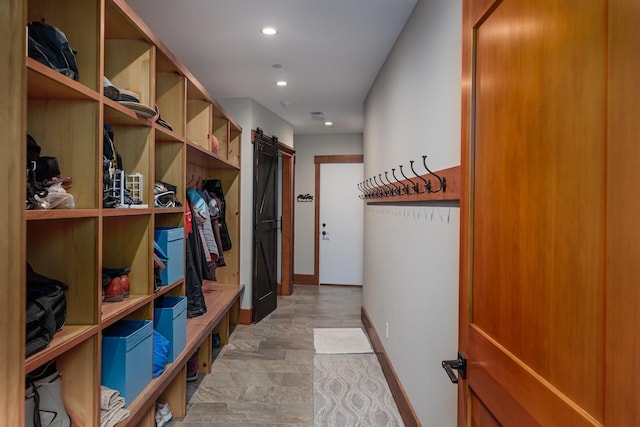 mudroom featuring a barn door