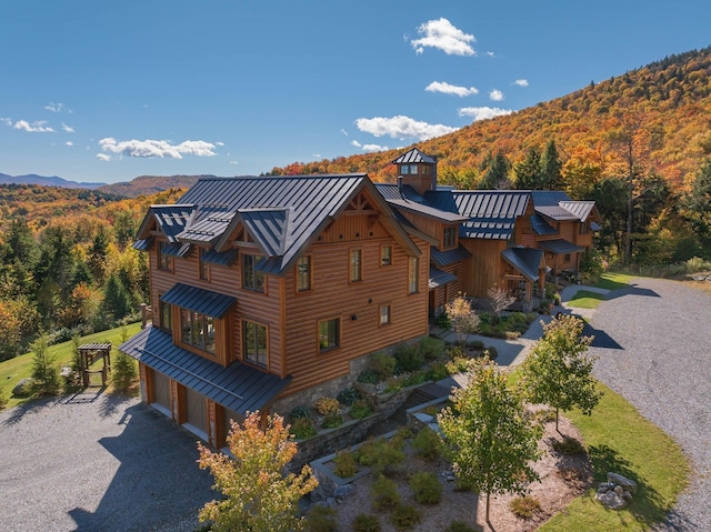 exterior space with a mountain view and a garage