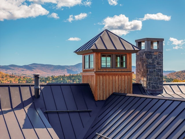 wooden deck featuring a mountain view