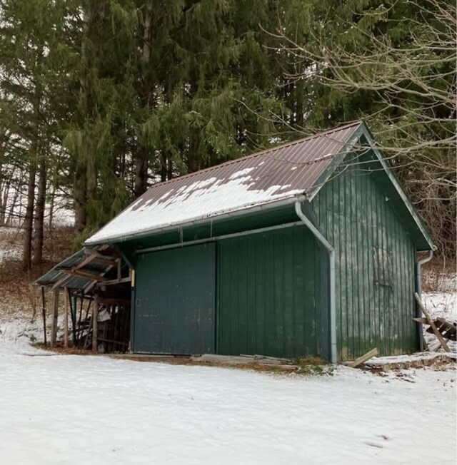 622 S Main St, Danby, VT 05739 - view of snow covered exterior featuring an outbuilding