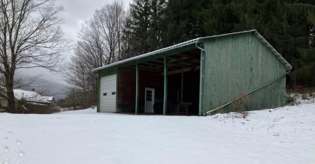 622 S Main St, Danby, VT 05739 - snow covered structure featuring a garage