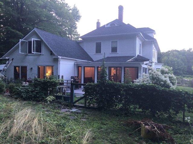 rear view of house with a chimney