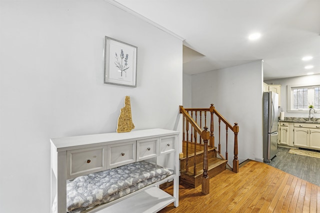 interior space with sink and hardwood / wood-style flooring