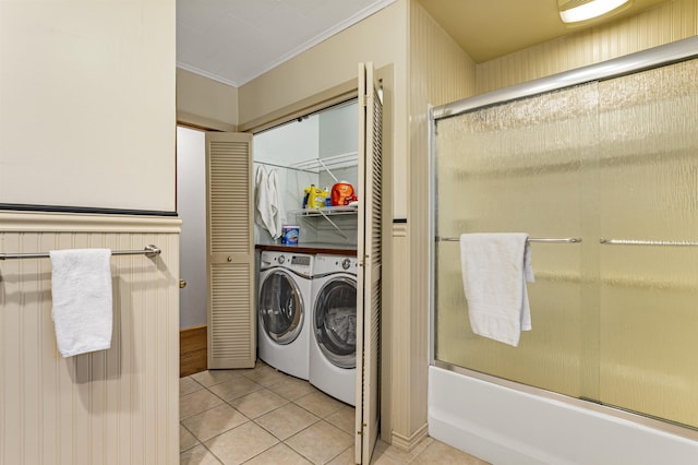 bathroom featuring tile patterned flooring, separate washer and dryer, crown molding, and bath / shower combo with glass door