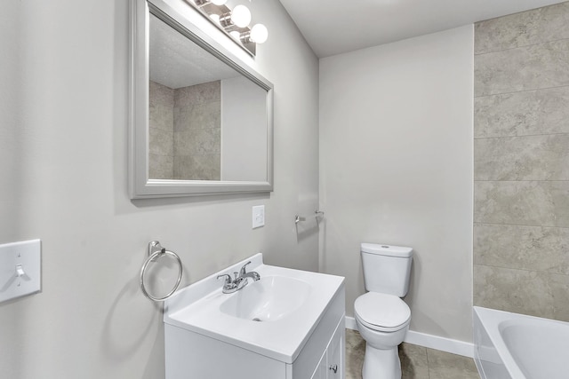 bathroom with tile patterned flooring, vanity, and toilet