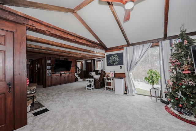 living room featuring beam ceiling, light carpet, and high vaulted ceiling