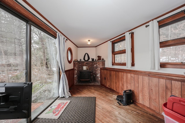 sunroom featuring a wood stove