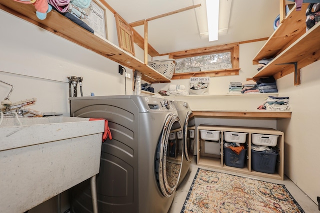 washroom featuring independent washer and dryer and sink