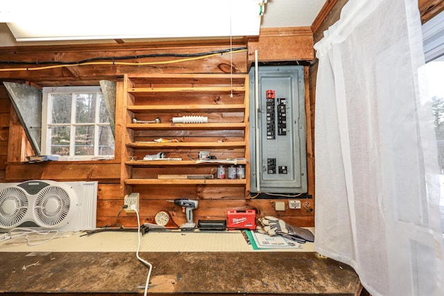 utility room featuring ac unit and electric panel