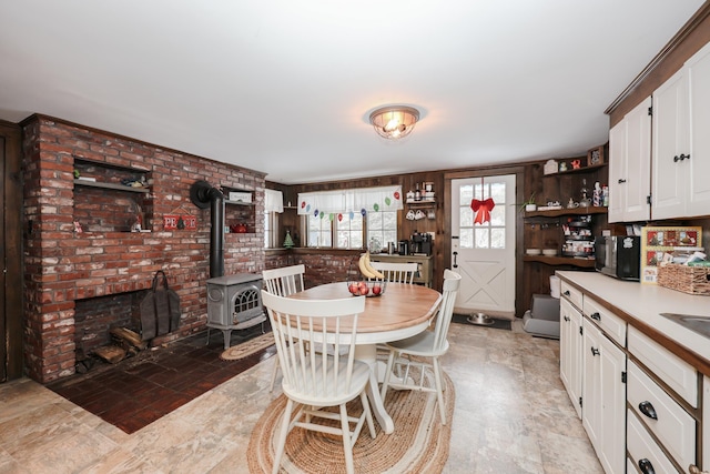 dining area with a wood stove