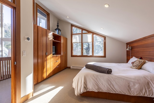 bedroom featuring multiple windows, light colored carpet, and a baseboard heating unit