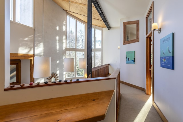 stairs with beam ceiling and carpet