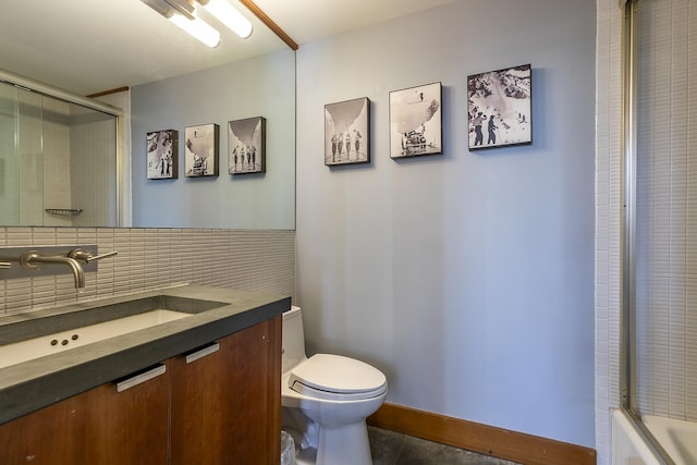 full bathroom with vanity, tile patterned floors, combined bath / shower with glass door, toilet, and tasteful backsplash