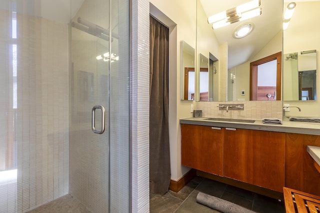 bathroom with tile patterned floors, an enclosed shower, vaulted ceiling, decorative backsplash, and vanity