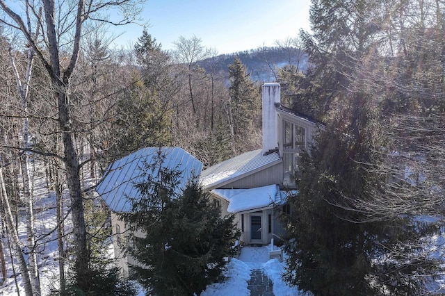 view of snow covered property