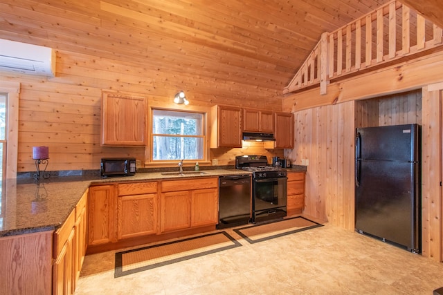 kitchen featuring under cabinet range hood, wood walls, a sink, black appliances, and a wall mounted air conditioner