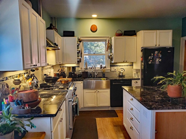 kitchen featuring black appliances, white cabinets, sink, light hardwood / wood-style flooring, and tasteful backsplash