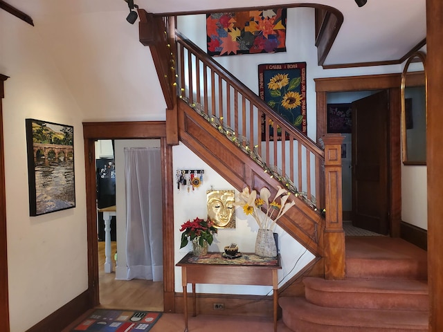 staircase with wood-type flooring