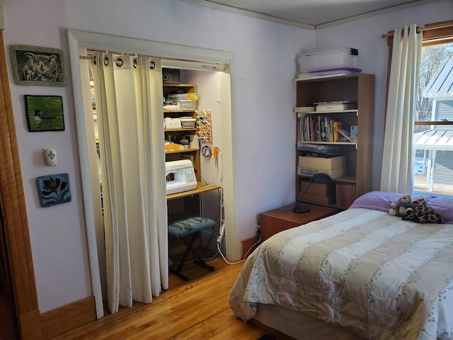 bedroom with light hardwood / wood-style floors