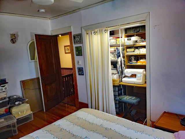 bedroom featuring dark hardwood / wood-style flooring and a closet