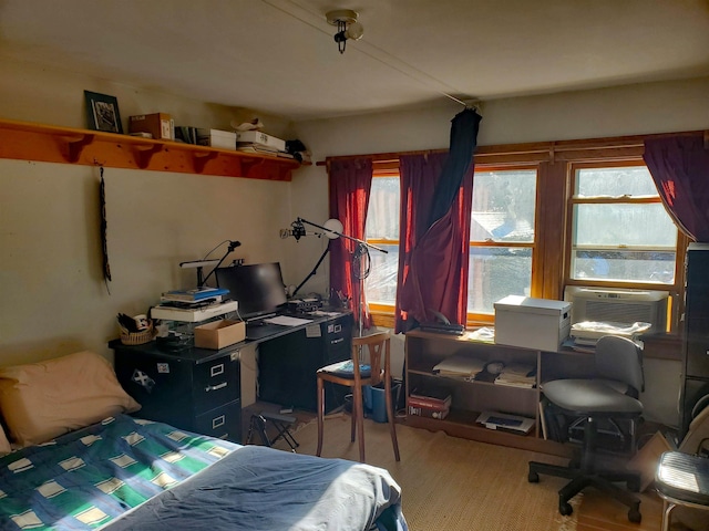 bedroom featuring hardwood / wood-style floors and cooling unit