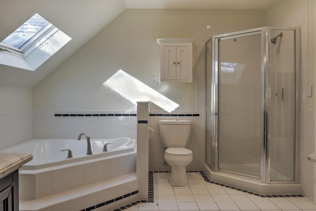 full bathroom with tile patterned floors, lofted ceiling with skylight, independent shower and bath, and vanity