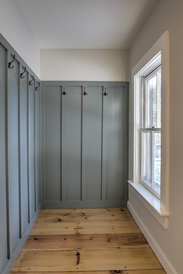 mudroom featuring light hardwood / wood-style flooring and a wealth of natural light