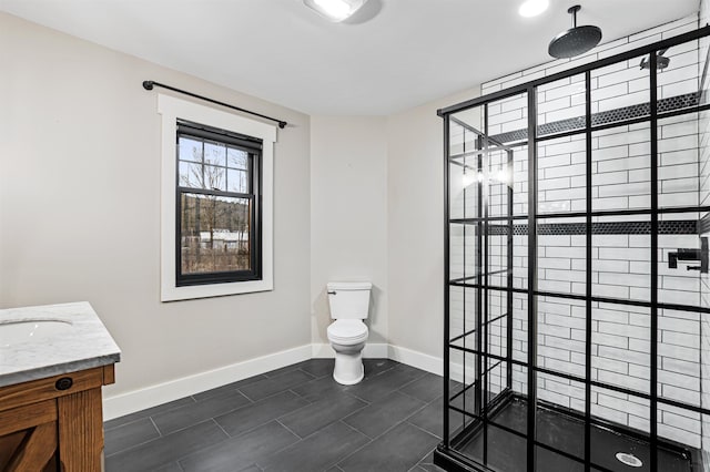 bathroom with tile patterned floors, vanity, toilet, and a shower