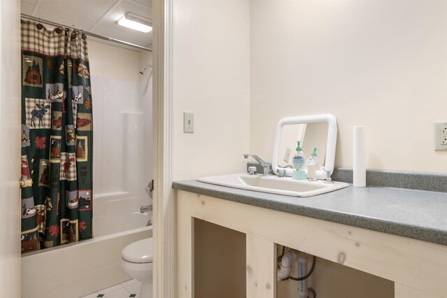 full bathroom with tile patterned flooring, shower / bath combo, vanity, and toilet