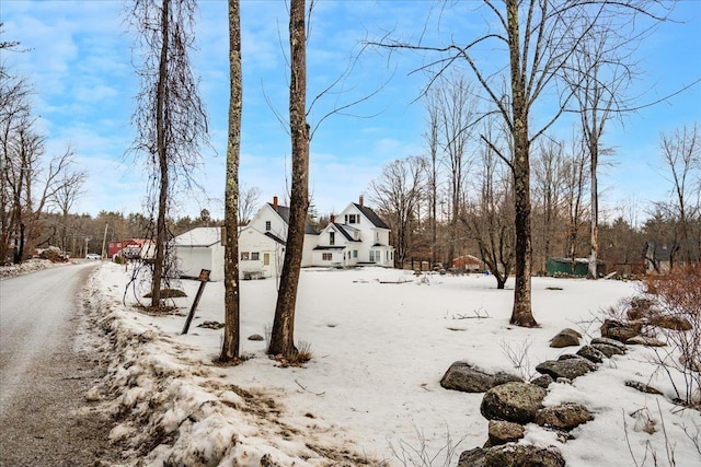 view of yard covered in snow