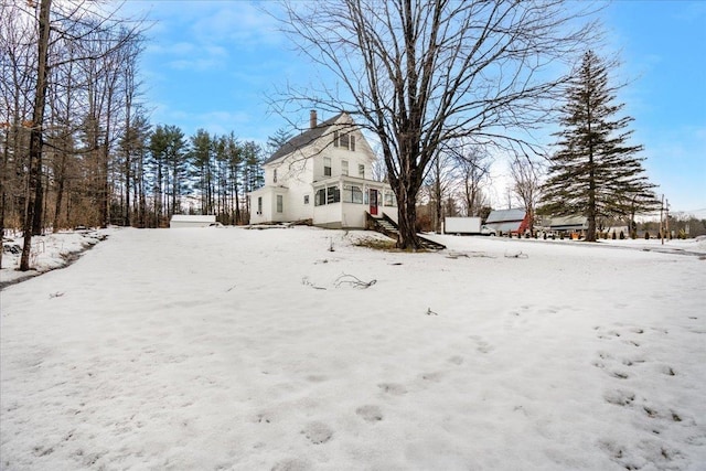 view of yard layered in snow