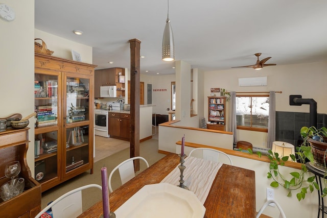 dining room with decorative columns and ceiling fan