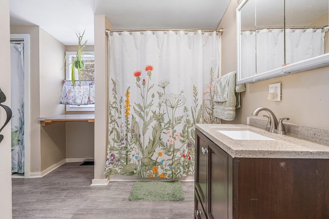 bathroom featuring vanity and wood-type flooring