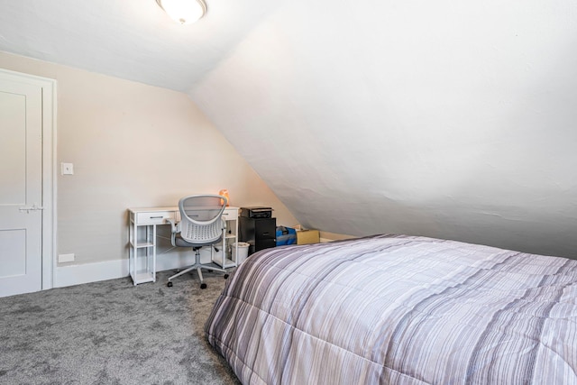 carpeted bedroom with lofted ceiling