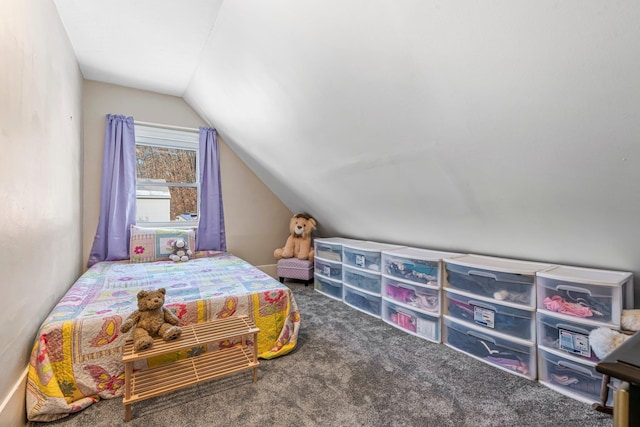 bedroom with carpet floors and vaulted ceiling