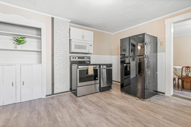 kitchen featuring stainless steel electric range, white cabinets, black fridge, crown molding, and light hardwood / wood-style flooring