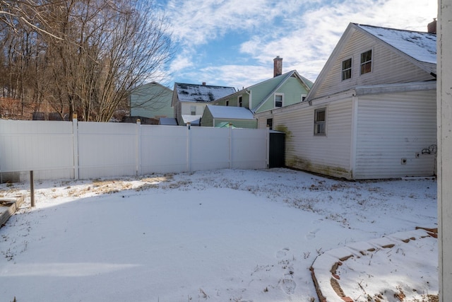 view of yard layered in snow