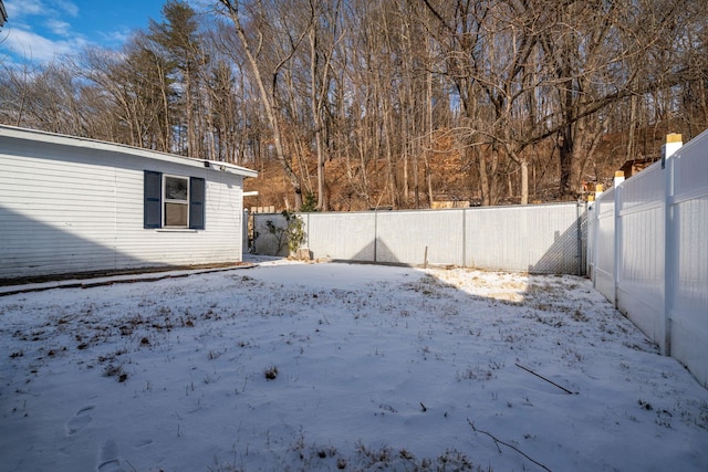 view of yard covered in snow