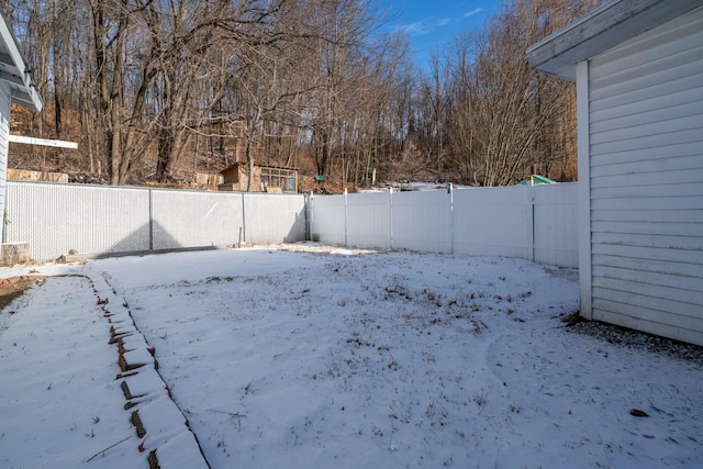 view of yard covered in snow